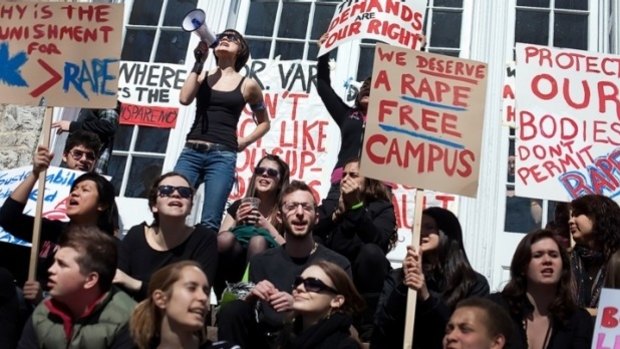 Students protest at University of Virgina after gang-rape reports.
