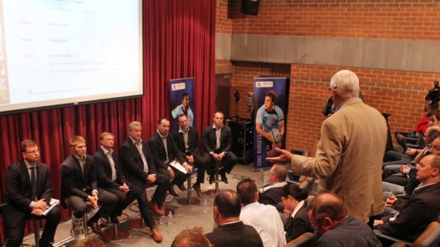 Panel beater ... a supporter questions the Waratahs' dour culture as the panel faces the music at last night's forum.