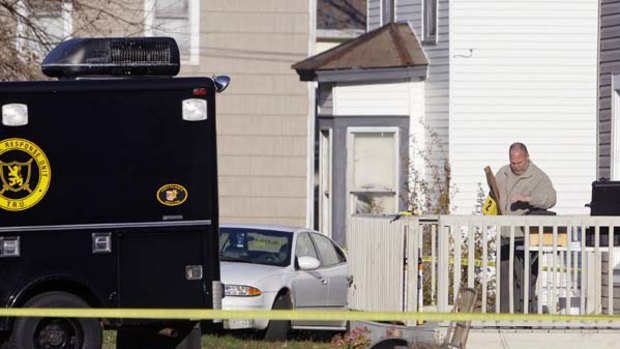 Police sweep Matthew Hoffman's home for evidence.