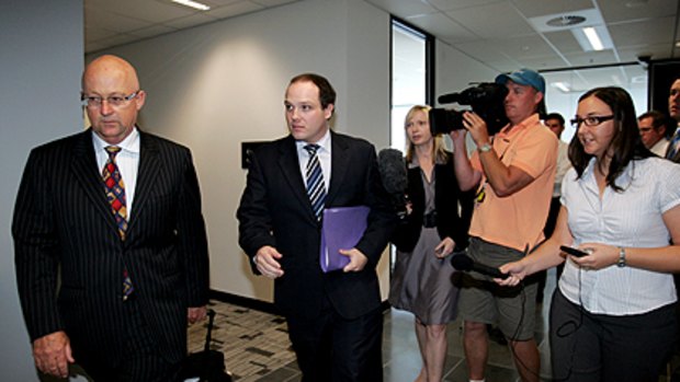 Former ministerial adviser Simon Tutt (centre) leaves after the hearing.