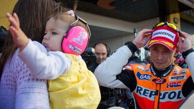Casey Stoner with wife Adriana and daughter Alessandra Maria.