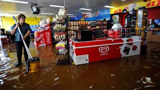 Employee Jo Daldy mops up at the BP service station on the Goulburn Valley Highway.