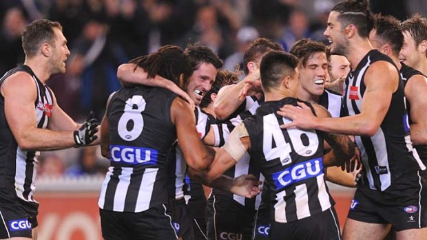 Collingwood celebrate Alan Didak's second-last goal for Collingwood against West Coast in round 22.