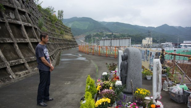 Yasuo Takamatsu at a memorial for the lost bank employees.