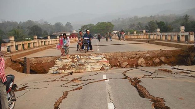 An earthquake-damaged road and bridge in Tarlay,  Myanmar.