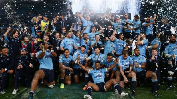 The Waratahs celebrate their triumph against the Crusaders.