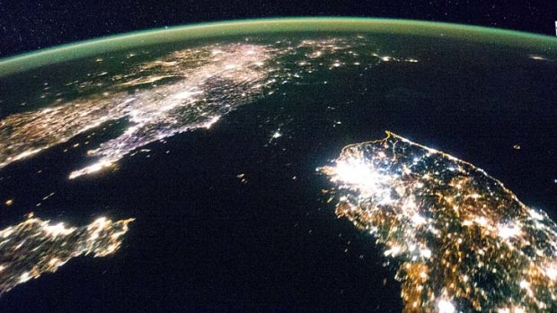 North and South Korea from space. North Korea is barely visible at night.
