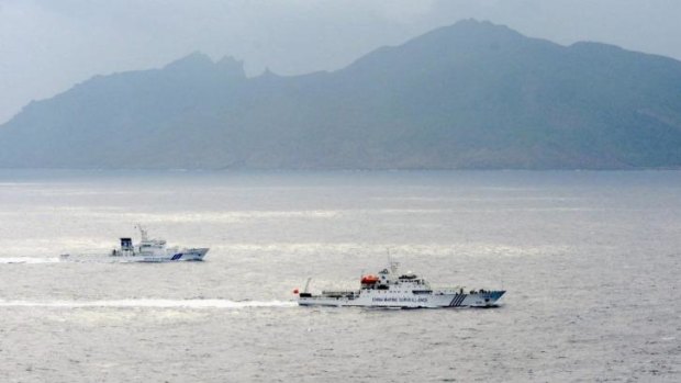 Tension: a Japanese coast guard vessel shadowing a Chinese surveillance ship last year near the disputed islands known as Senkaku in Japan and Diaoyu in China.