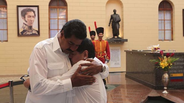 Mourning: Nicolas Maduro and Maradona at Hugo Chavez's tomb.