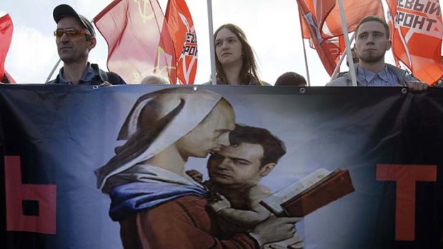 A banner in Moscow mocking Mr Putin and Mr Medvedev.