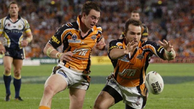 Grand finale ... Todd Payten bats Liam Fulton to score the last try of the 2005 premiership decider.