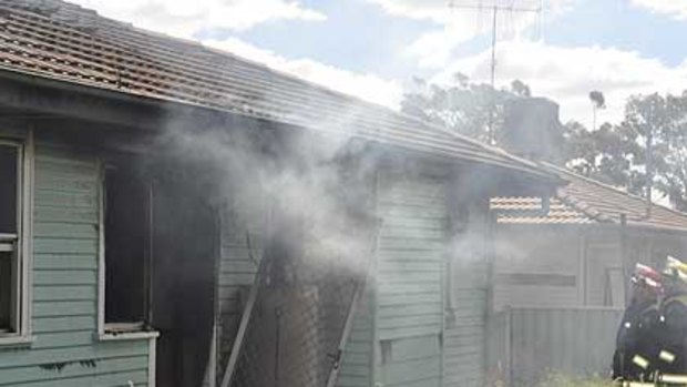 The smouldering home after the fatal fire.