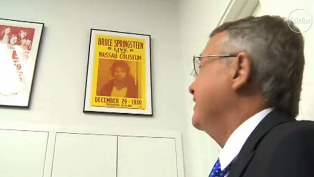 Acting Prime Minister Wayne Swan with a Bruce Springsteen poster in his office.