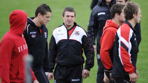 Steven Baker (centre) at St Kilda training yesterday. Despite his lengthy absence, the backman is poised to line up in the first week of the finals.