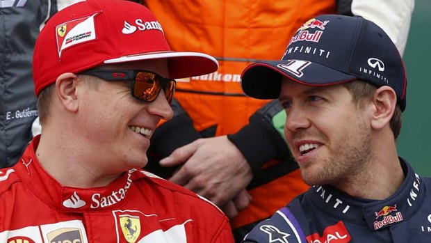 Kimi Raikkonen with Red Bull's Sebastian Vettel.