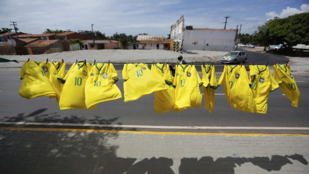Wave of support ... Brazil national football team T-shirts are displayed while on sale on a road on the way to the Castelao stadium in Fortaleza.