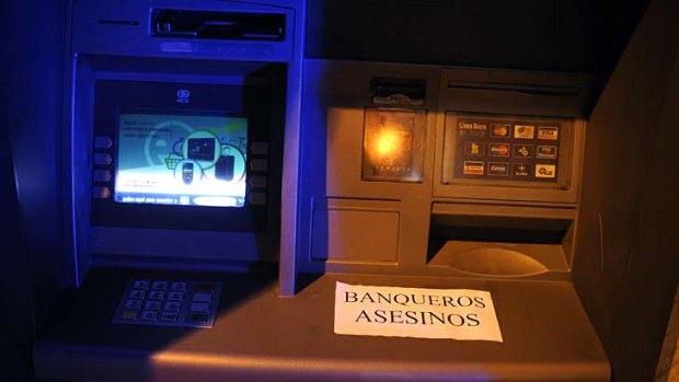 Basque anger ... a sticker on an ATM in Baracaldo reads ''Bankers, Murderers''.