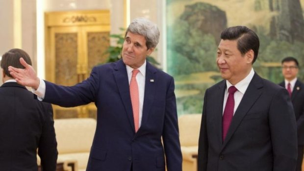 "Non-confrontational": John Kerry and Xi Jinping in Beijing on Friday.