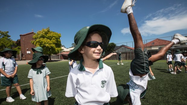 Our Lady of Fatima school introduced sunglasses, worn here by Alexia Challita, 6, as an optional part of the school uniform.