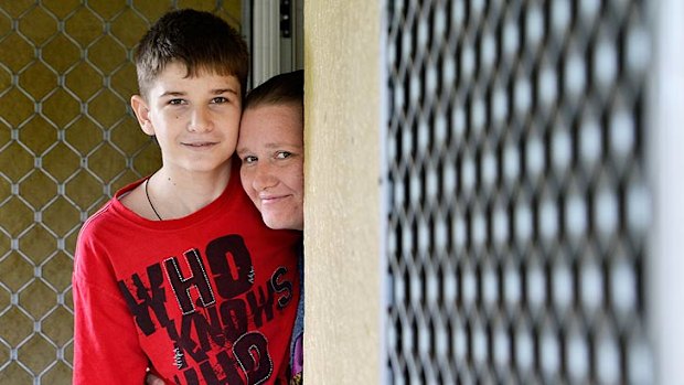 Michael Boggan, 15, at home with his mother Rebecca.