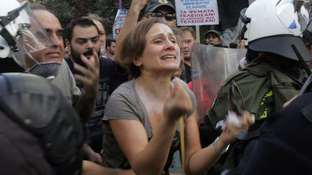Protesters clash with riot police in Athens.