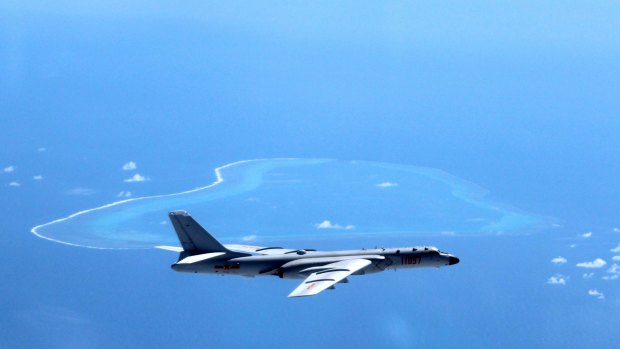 A Chinese H-6K bomber patrols the islands and reefs in the South China Sea. 