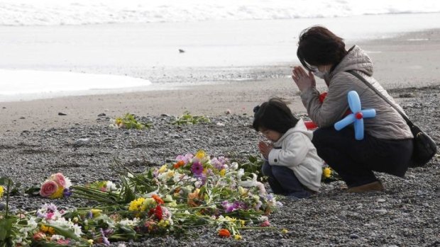 Paying respect at Fukushima, one year on: More than 18,000 people died when the tsunami hit.