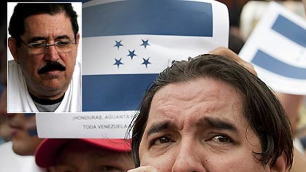 Demonstrators hold up Honduras's flag as they take part in a show of support for President Manuel Zelaya, inset.