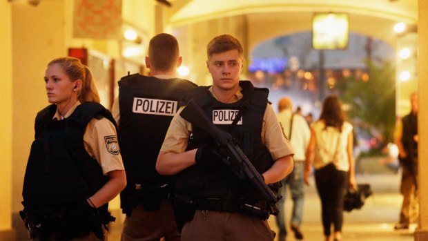 Armed police guard the downtown pedestrian zone in Munich following a rampage shooting in the city.