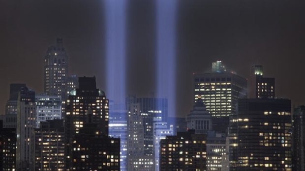 A test of the Tribute in Light rises above lower Manhattan.