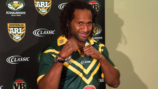 Familiar feeling . . . Lote Tuqiri puts on an Australian jumper at Homebush after being recalled to the Kangaroos team for the first time in eight years.