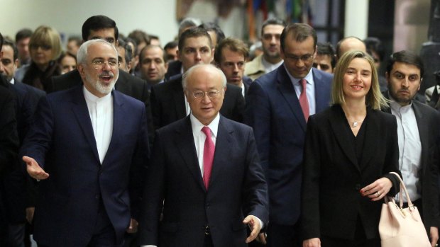 Iranian Foreign Minister Mohammad Javad Zarif, left, with International Atomic Energy Agency chief Yukiya Amano and European Union High Representative Federica Mogherini, right, arrive at the agency's HQ in Vienna in January 2016.