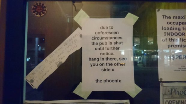 The notice taped to the window of the popular Phoenix bar on East Row.