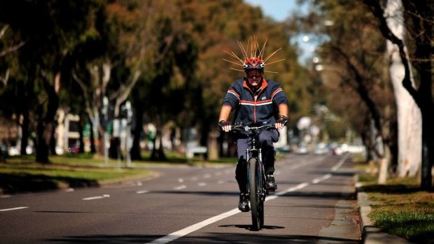 A cyclist along Northbourne Ave today takes the scaring of magpies away to the extreme.