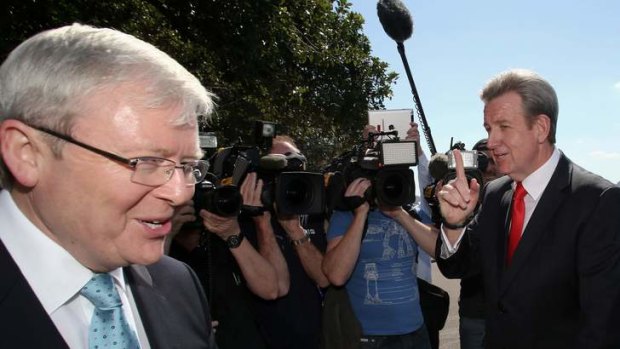 NSW Premier Barry O'Farrell confronts Prime Minister Kevin Rudd near the Garden Island Naval facility in Sydney on Tuesday.