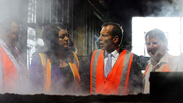 ''I am not in the business of ignoring a big audience'' ... Tony Abbott, right, with the MP for Paterson, Bob Baldwin, and Newcastle Liberal Party candidate Jaimie Abbott, during a visit to the Weathertex factory north of Newcastle yesterday.