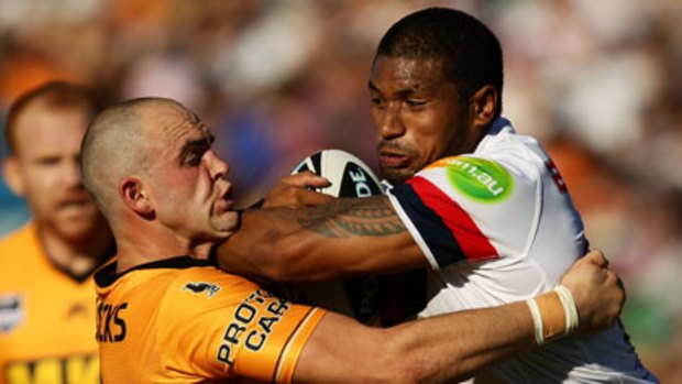 Body on the line... Tigers hooker Liam Fulton cops Frank-Paul Nuuausala's forearm yesterday.