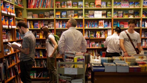 Take it as read &#8230; shoppers peruse the shelves at Books Kinokuniya in the city - while the rest of the retail sector is having a hard time, book shops are reporting better-than-expected sales as customers pour in over the festive period.