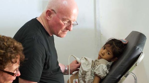 Noel Bayley examines Ila Amaral at a clinic in Dili last year.
