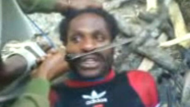 A still from a video published by Fairfax Media in 2010 showing the torture of two West Papuan men. Indonesia has instituted a "policy of terror" in West Papua, a new study says.