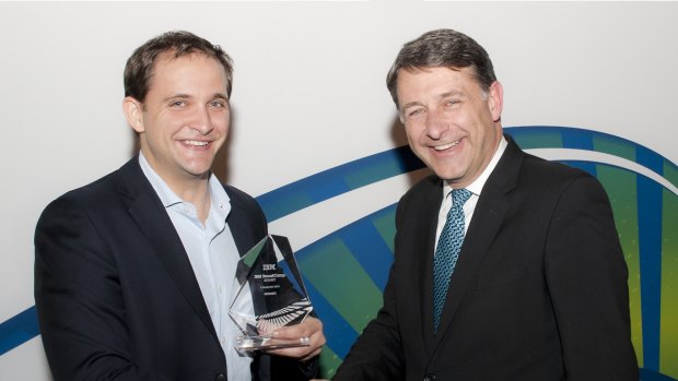 Carl Hartmann, founder of Temando, accepts the 2013 IBM SmartCamp winner award from Andrew Stevens, managing director, IBM Australia and NZ.