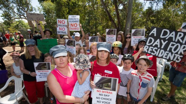 Murrumbeena residents Karlee Browning and Tracey Bigg attend a protest earlier this month against a proposed elevated railway line. 