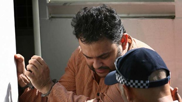 Chase that came to nothing ... Australian lawyer Julian Moti is taken to court after his arrest in 2006.