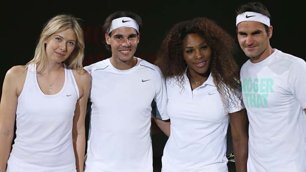 Game on: Maria Sharapova, Rafael Nadal, Serena Williams and Roger Federer warm up in Paris.