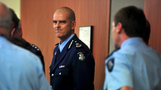 Time's up: Simon Overland after announcing his resignation as Victoria Police Chief Commissioner yesterday.