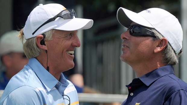 Greg Norman and Fred Couples before the start of play yesterday.