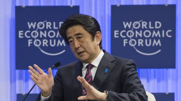 Japanese prime minister Shinzo Abe gestures as he speaks at the World Economic Forum in Davos, Switzerland.