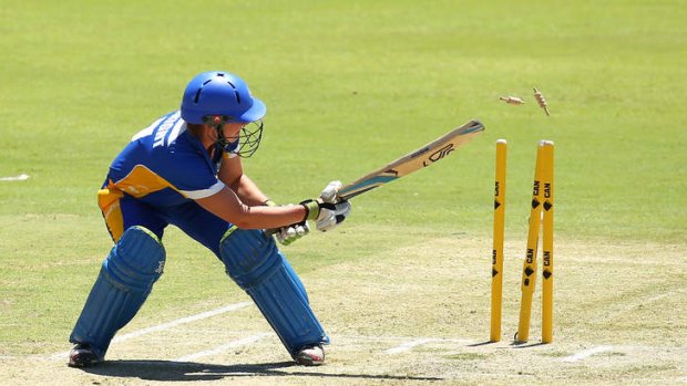 Laura Wright of the Meteors plays the ball onto her stumps during the WT20 Final match between Queensland and the ACT at WACA.