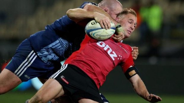 Wrapped up: Crusaders veteran Andy Ellis is smashed by Blues forward Tony Woodcock.