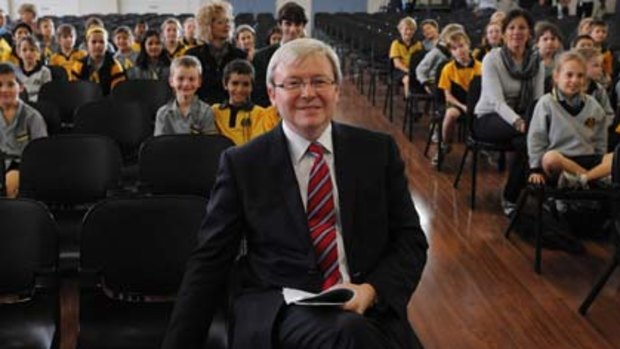 Change of climate ... Kevin Rudd takes a seat among students in his electorate of Griffith in Brisbane's south.